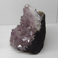 Side view of Amethyst stalactite cluster showing dark matrix and radiant lavender crystals – 4.2 lb hand-cleansed piece