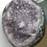 Close-up of a purple crystal formation on a white background