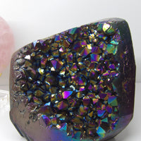 Multicolored Aura quartz crystal on a white background