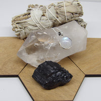 Quartz point with rainbows, black tourmaline and moonstone necklace