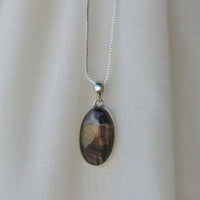 Oval Labradorite Pendant with Iridescent Purple Hues