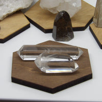 Close-up of clear polished phantom quartz points showing internal phantom layers.”