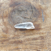 Clear crystal on a wooden surface