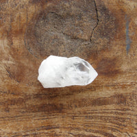 Natural clear quartz point with milky bottom