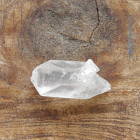 Natural clear quartz point - self healed