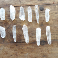 Crystal points arranged on a wooden surface