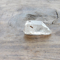 Clear quartz crystal point natural inclusion