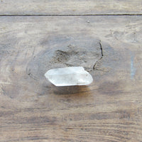 Clear crystal on a wooden surface
