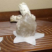 semi-polished smoky quartz point on display