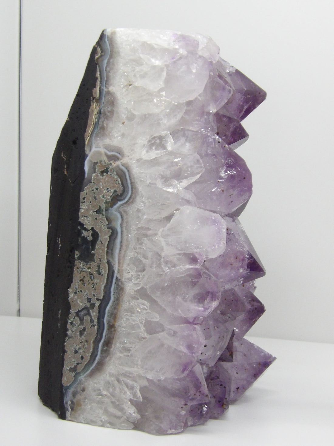 Amethyst cut base cluster with natural banding and raw edge, display piece from Star Woman Crystals Scottsdale AZ