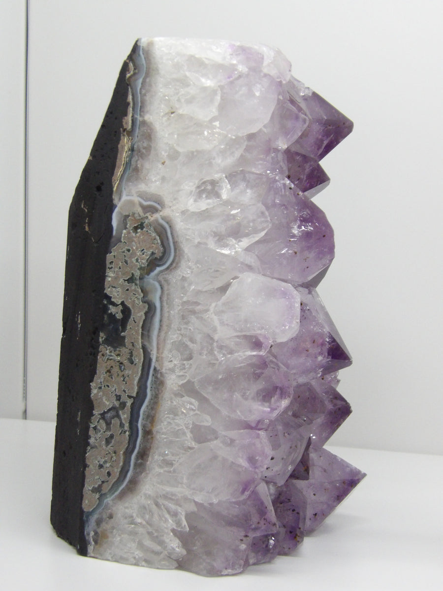 Amethyst cut base cluster with natural banding and raw edge, display piece from Star Woman Crystals Scottsdale AZ