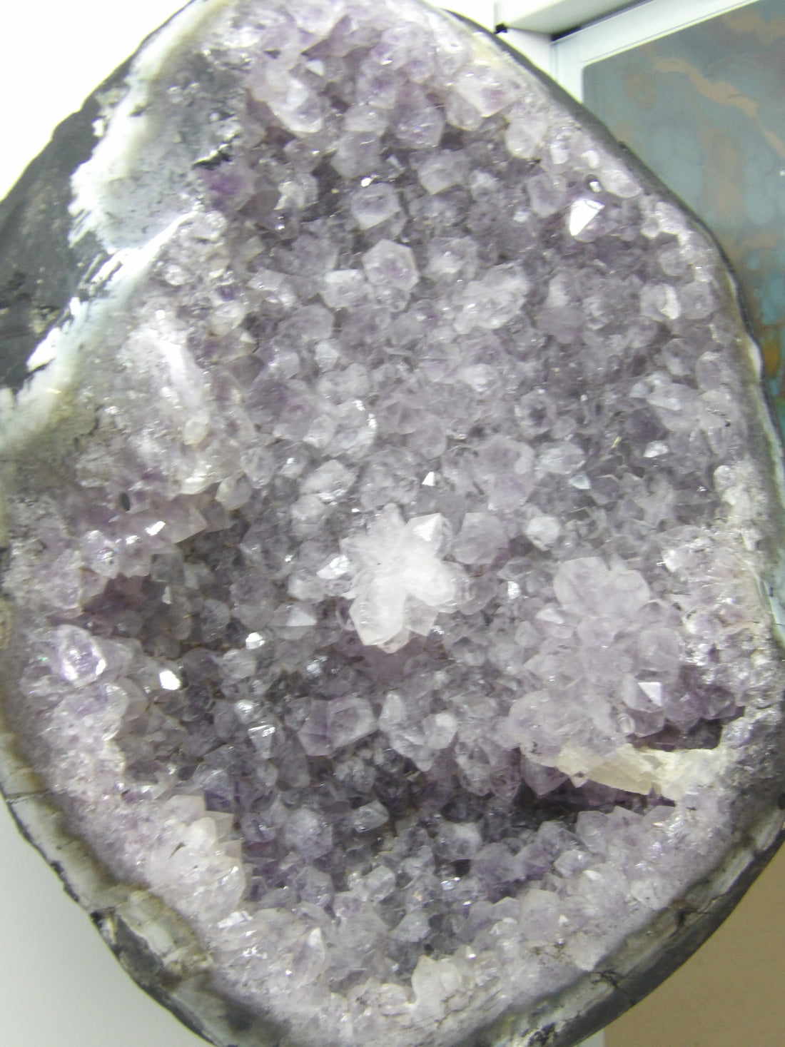 Close-up of a crystal formation with purple and clear crystals.