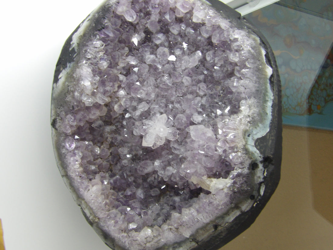 Close-up of a purple crystal formation on a white background