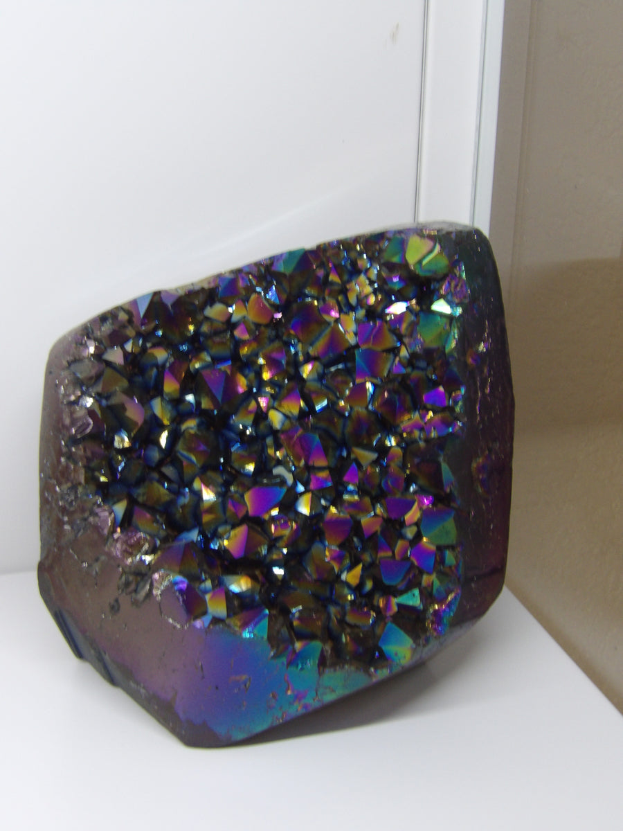 Aura Quartz crystal on a white background