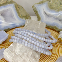 Natural 5 mm Blue Lace Agate stretch bracelet with polished pale blue banded gemstone beads.