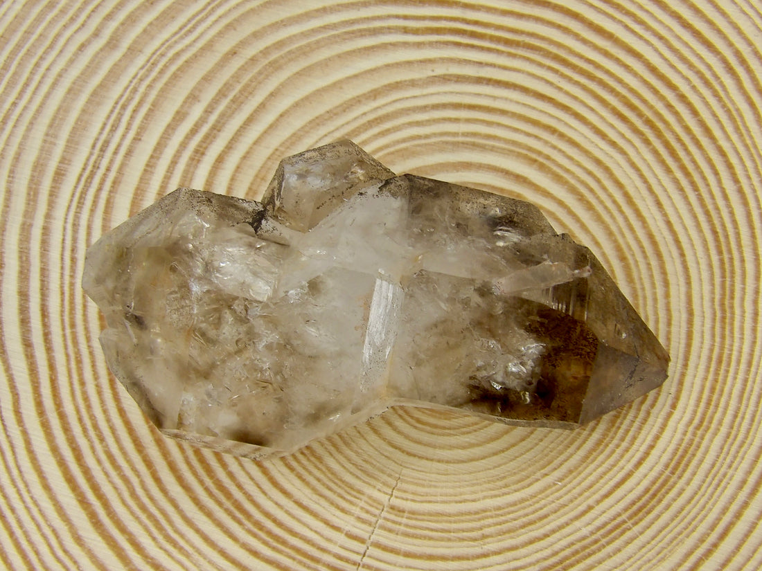 Natural double-terminated Brandberg Quartz from the Brandberg Massif, Erongo Region, Namibia with smoky coloration, internal inclusions, and a companion crystal.