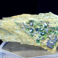 Natural 100g Demantoid Green Garnet specimen from Balochistan Pakistan featuring small brilliant green garnet crystals on earthy natural matrix.