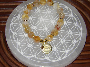 Handmade citrine abundance manifestation bracelet with gold star and lotus charms