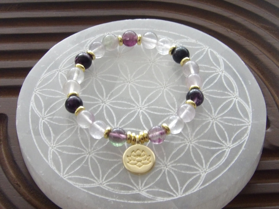 Handmade fluorite Divine Focus bracelet with 18k gold-plated lotus bead and gold spacers from Star Woman Crystals.