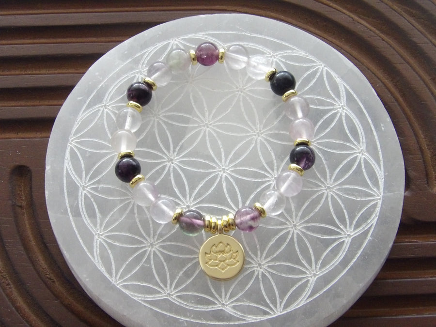 Natural fluorite bracelet with 18k gold-plated lotus bead for mental clarity and grounding.