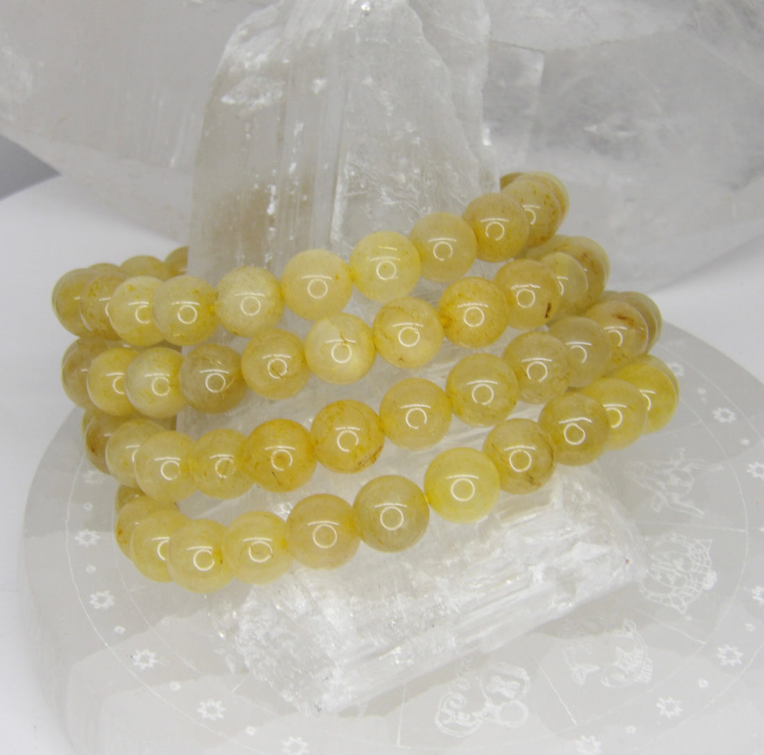 Natural 8mm Golden Copper Rutile Quartz stretch bracelet featuring polished quartz beads with copper rutile inclusions.