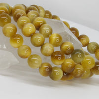 Natural 10mm Golden Tiger's Eye stretch bracelet featuring polished gemstone beads with beautiful golden chatoyancy and warm earthy tones.