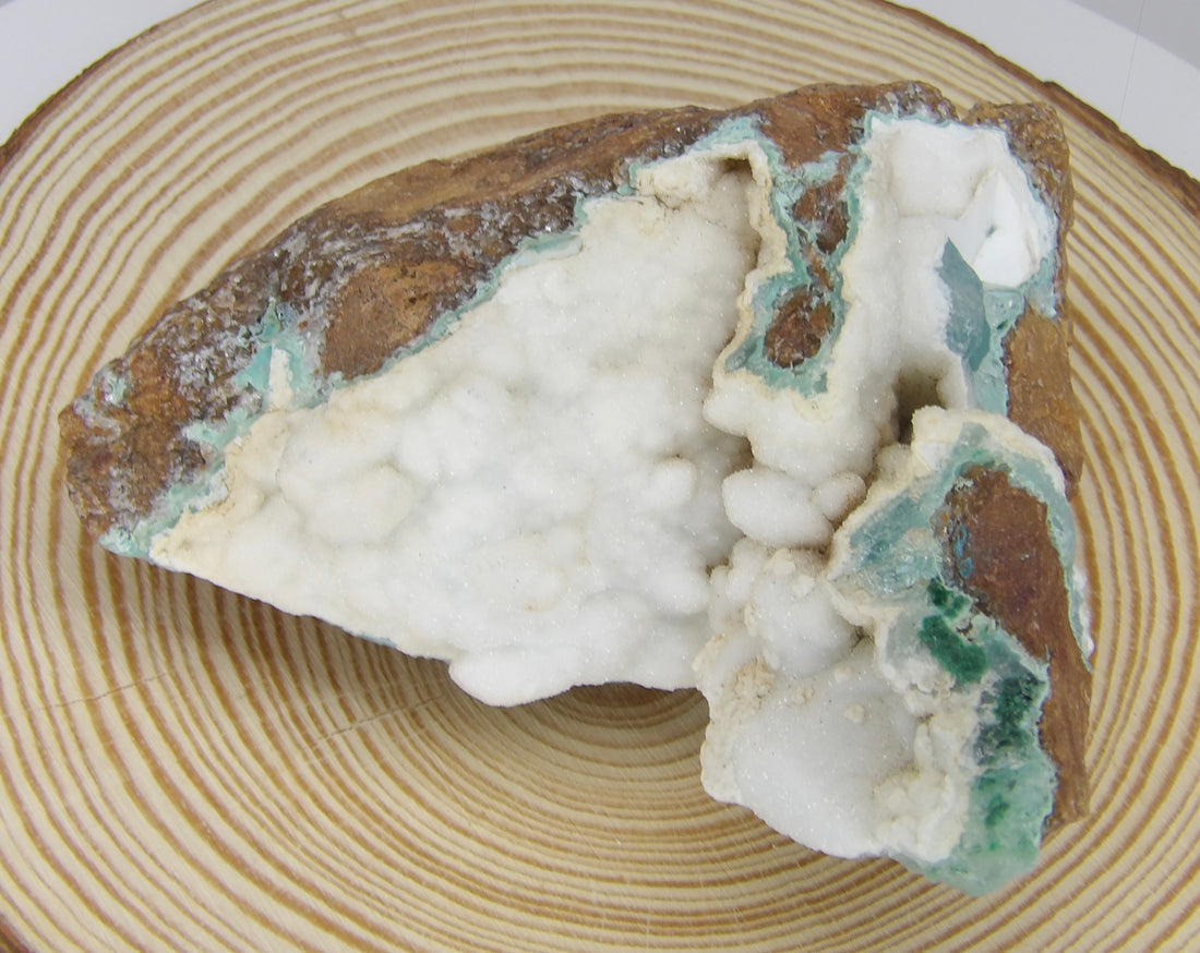 Natural Hemimorphite specimen from Tenke-Fungurume, Democratic Republic of the Congo featuring soft blue crystal formations on natural white matrix.