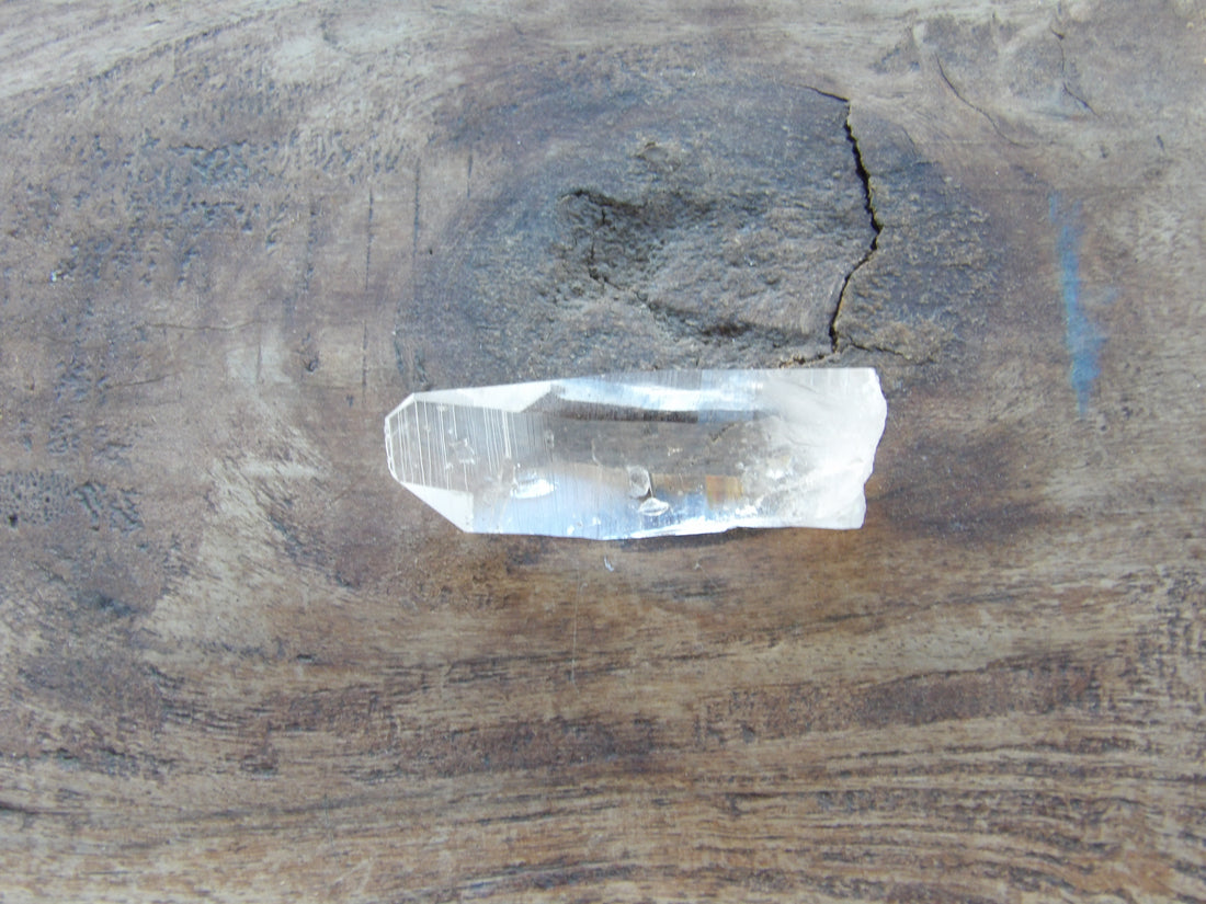 Natural quartz Lemurian crystal with surface texture