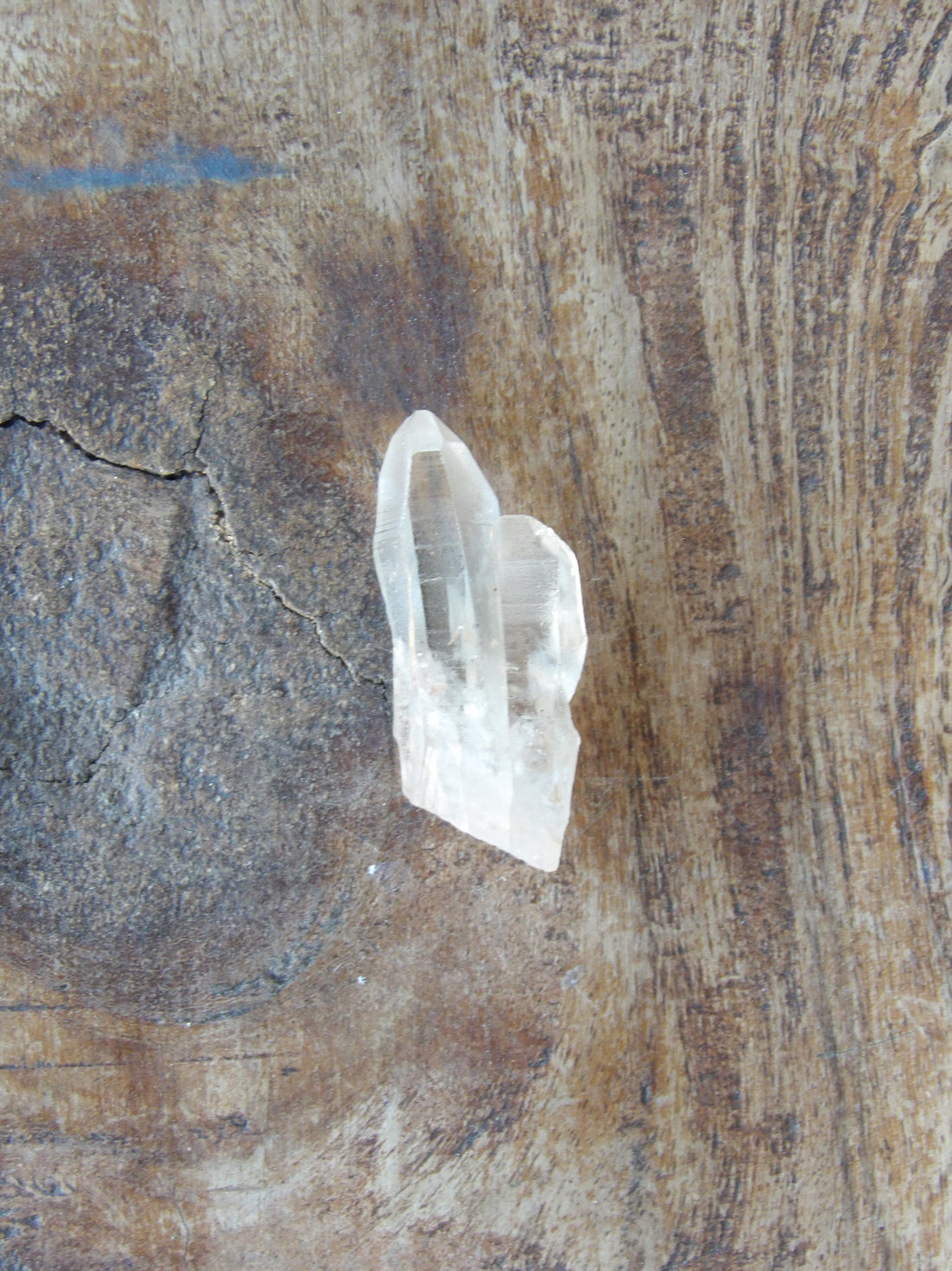 Raw Lemurian quartz crystal with twin formation