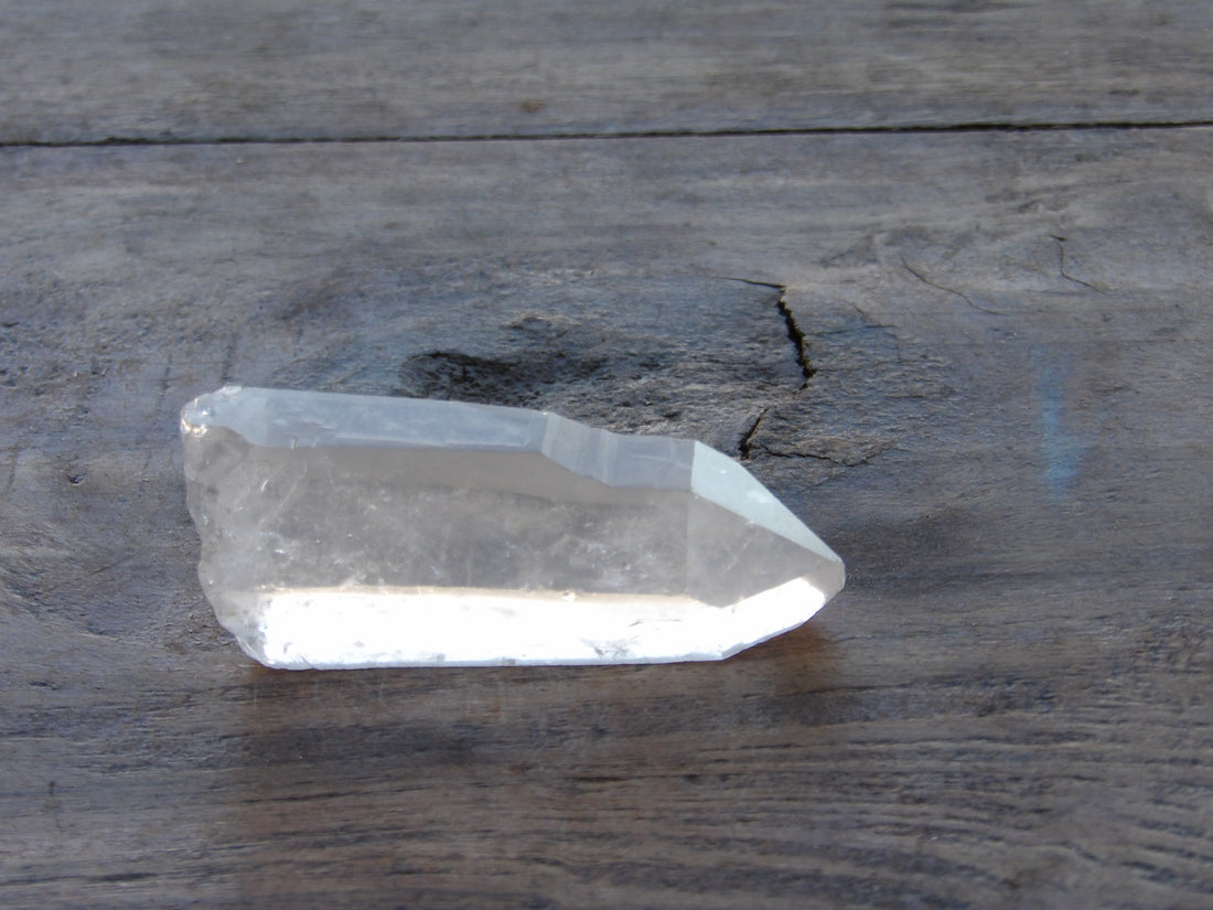 Raw Lemurian quartz point with subtle striations