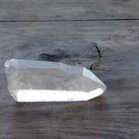 Raw Lemurian quartz point with subtle striations