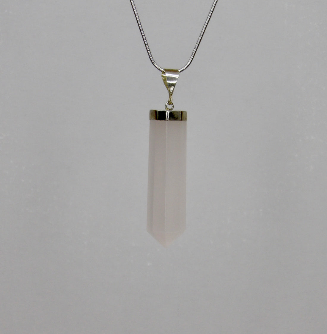 Natural Mangano Calcite pendant with 925 sterling silver bail, polished crystal point necklace, UV reactive fluorescent pink crystal.
