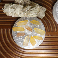 Small raw tangerine quartz crystals displayed for sale