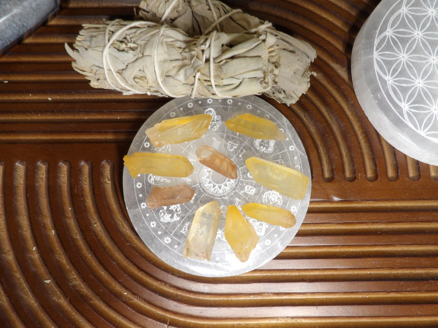 Small raw tangerine quartz crystals displayed for sale