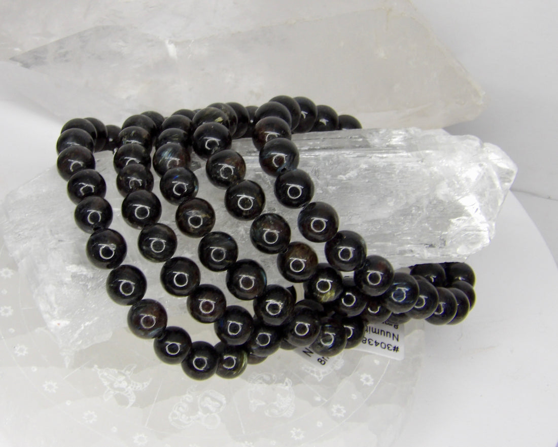 Natural 8mm Nuummite stretch bracelet with polished charcoal-black gemstone beads.