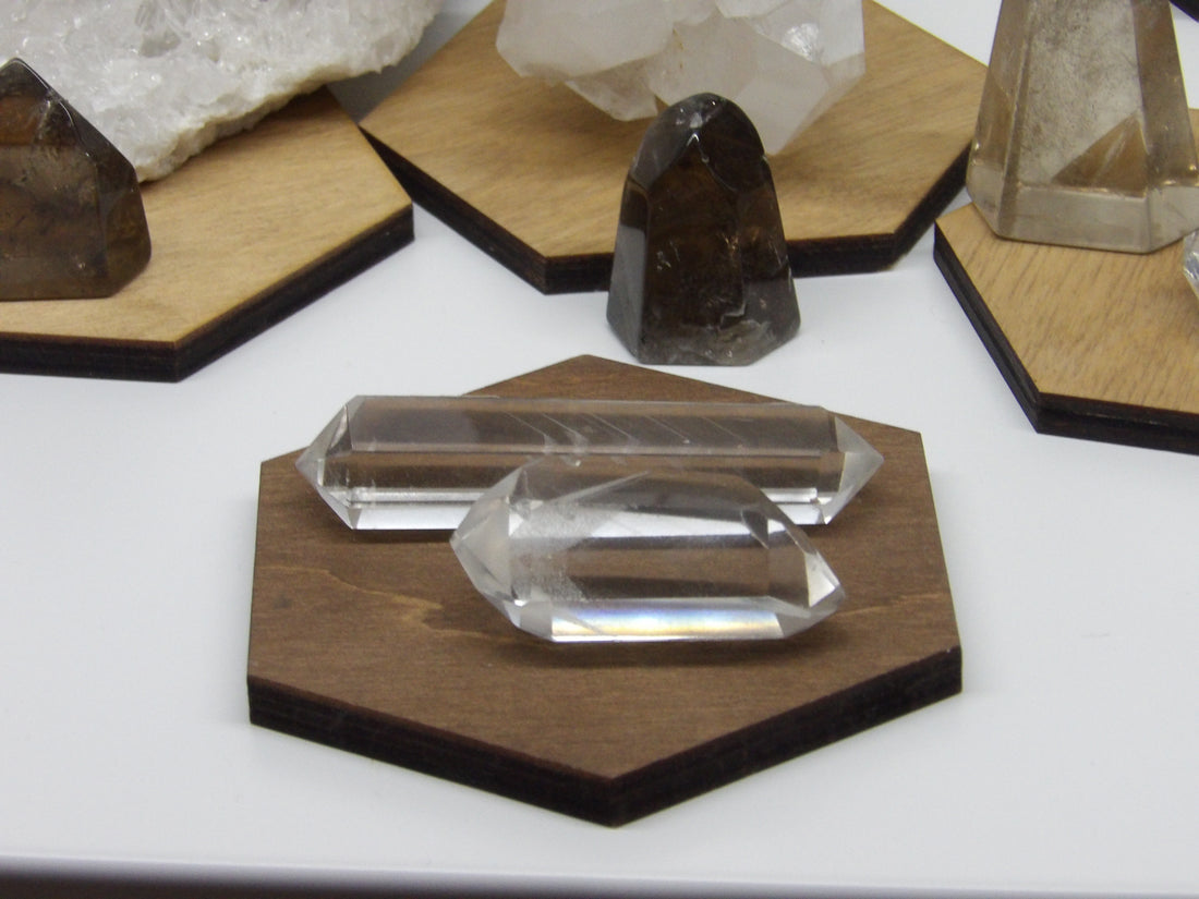 Close-up of clear polished phantom quartz points showing internal phantom layers.”