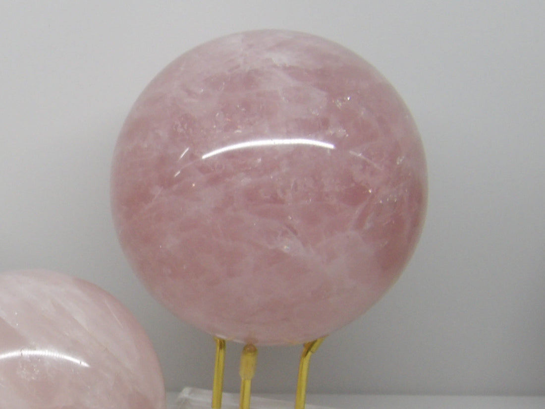 Large rose quartz sphere with gorgeous pink tones, emotional healing stone.