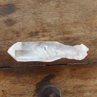 Self Healing clear quartz on wooden surface