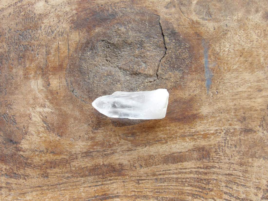 Natural companion clear quartz point