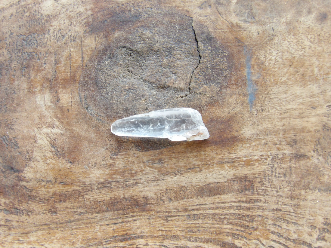 Clear crystal on a wooden surface