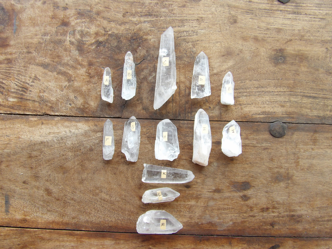 Clear crystal points on a wooden surface