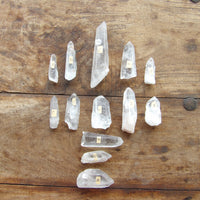 Clear crystal points on a wooden surface