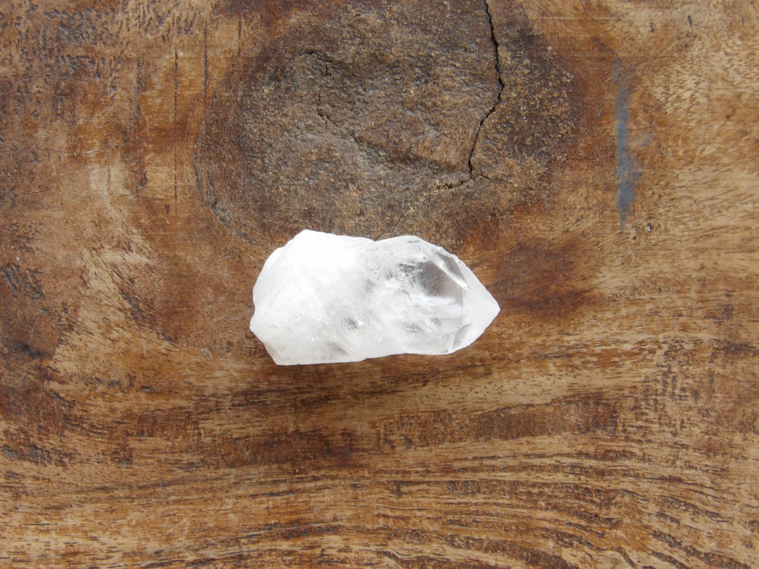 Natural clear quartz point with milky bottom