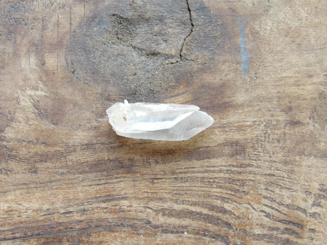 Twin Natural clear quartz point on wood table