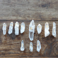 Crystal points arranged on a wooden surface