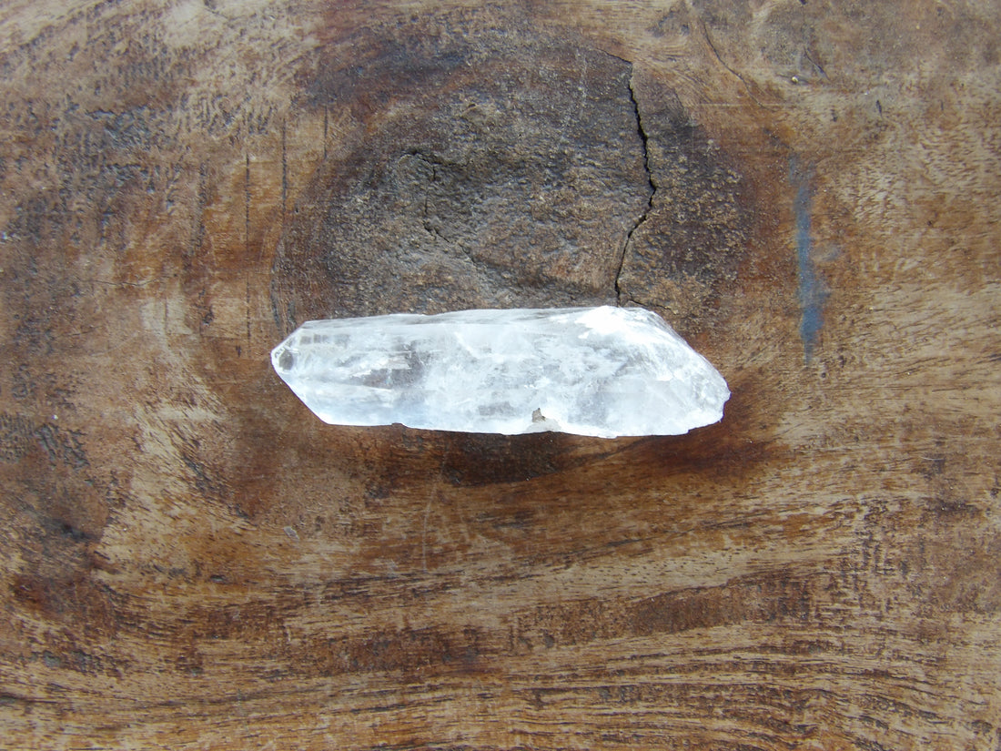 Clear crystal on a wooden surface