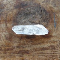 Clear crystal on a wooden surface