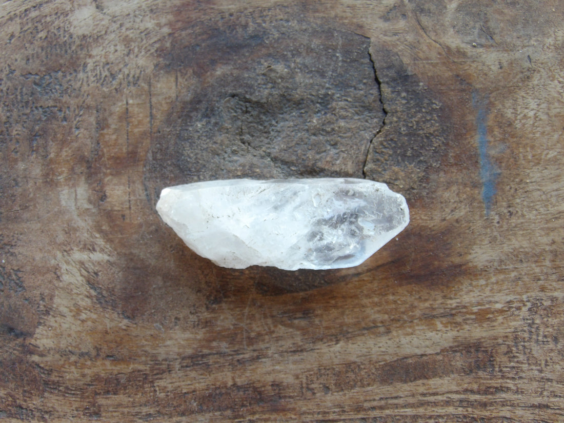 Tabular crystal on wooden table