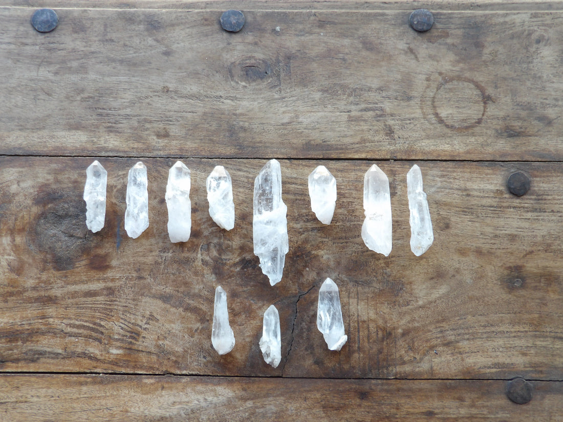 Crystal points arranged on a wooden surface