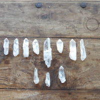 Crystal points arranged on a wooden surface
